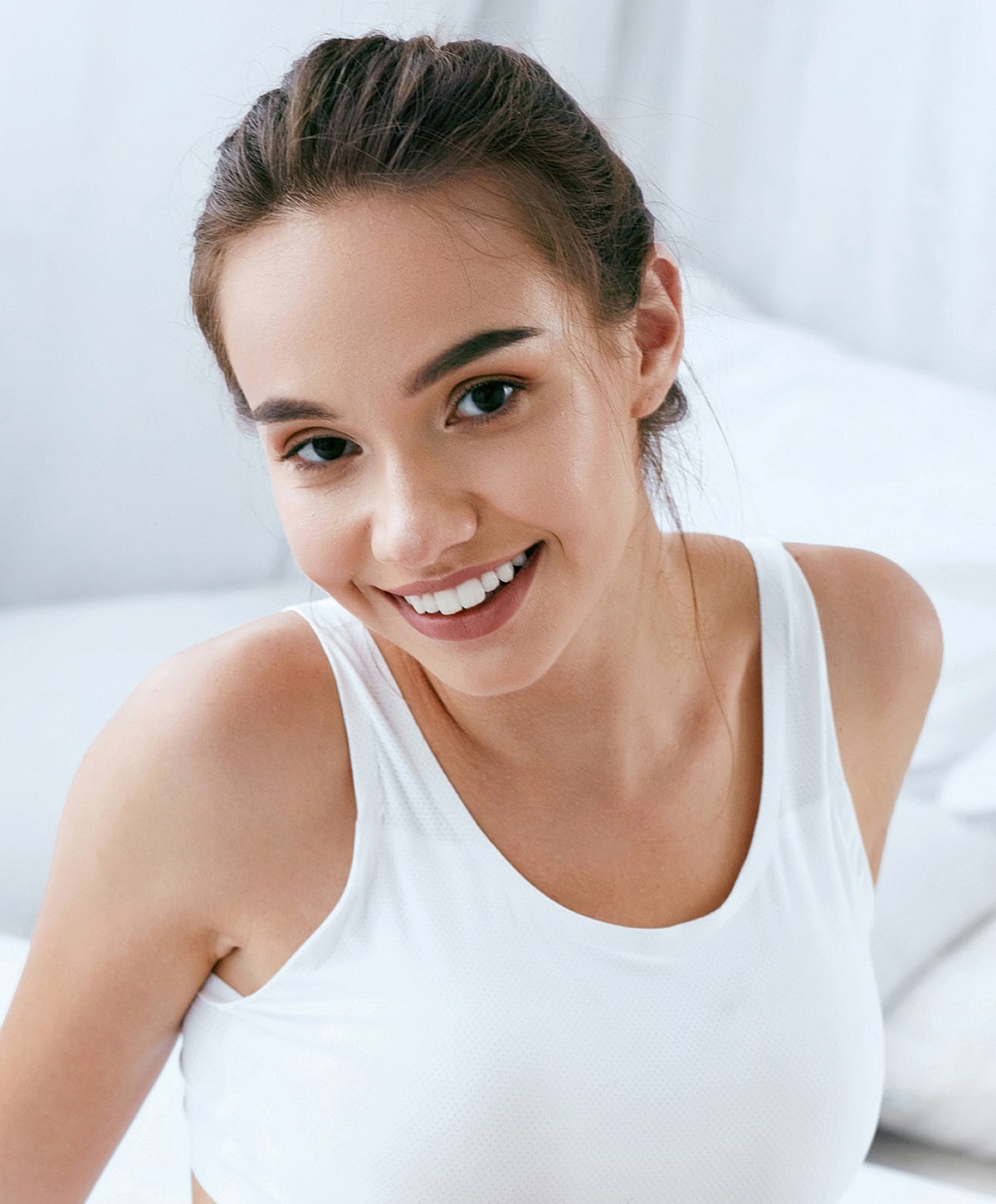 Model in blue activewear striking a pose.